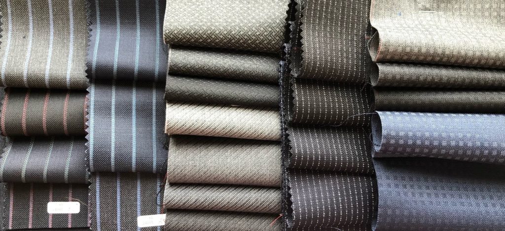 William Halstead : Developed from their classic British twill suit fabric construction with the introduction of mohair into the weft across a 2-ply worsted warp, this cloth highlights the signature fibre of William Halstead in a resilient fabric. The unique aspect of the clean surface appearance is created when every metre of fabric is passed through a flame to remove unnecessary surface fibre