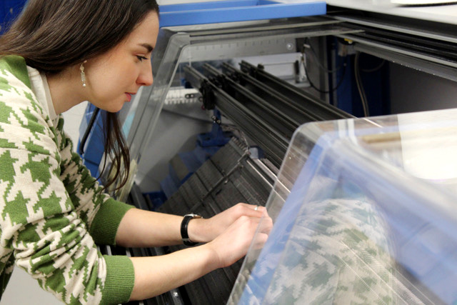 Jessica Turnbull working at a knitting machine
