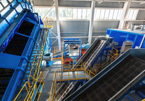 A modern plant for sorting and recycling household waste and waste. Large industrial complex of conveyors, bunkers.